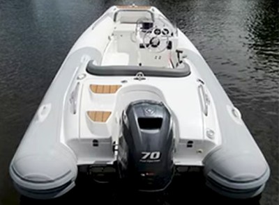 Rib boat rear view with outboard motor